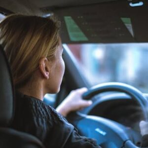 New UK driver holding a full driving licence with information about penalty points, driving rules and licence restrictions in 2026